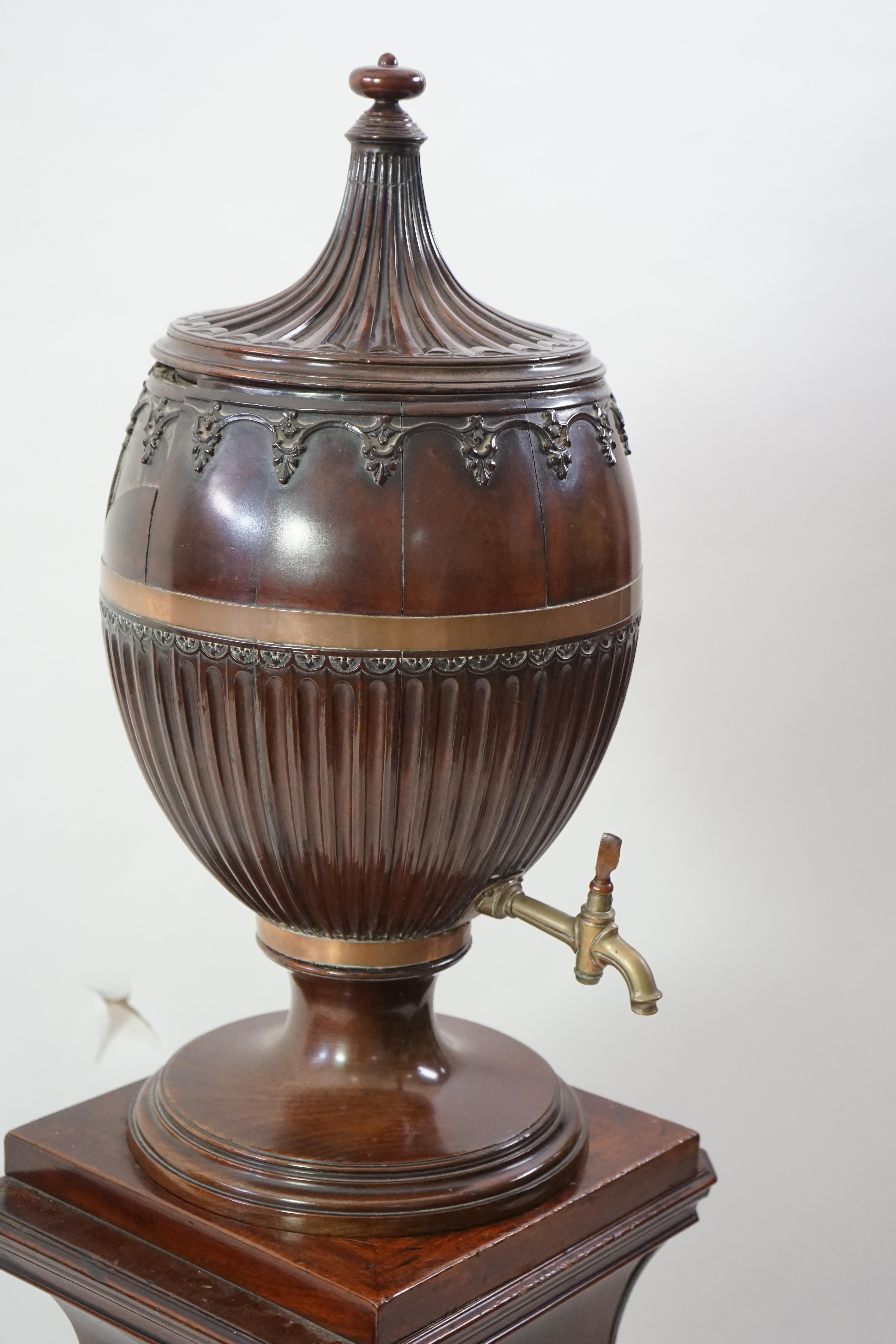 An 18th century Dutch carved mahogany wine cooler and cover